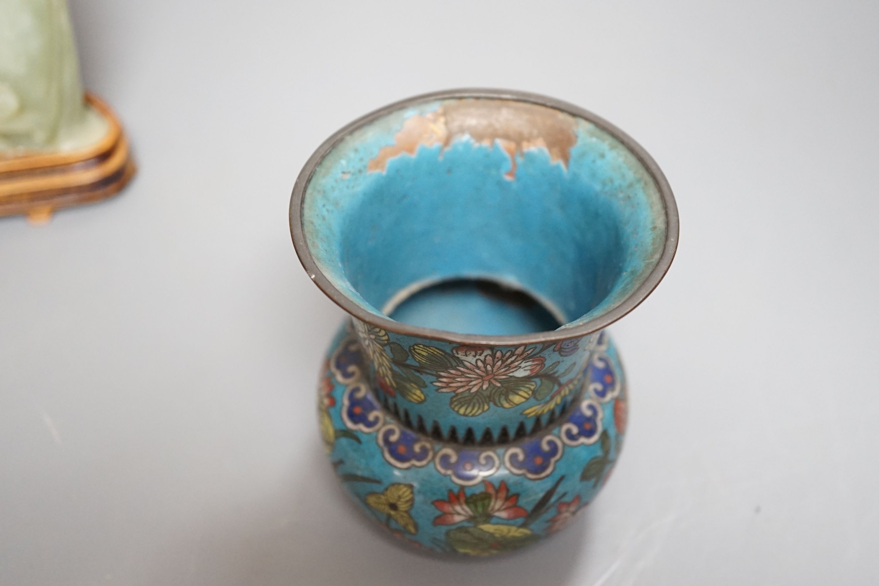 A small enamelled cloisonné vase, 10cm, together with a carved bowenite jade figure, on wood plinth and glazed ceramic brush pot